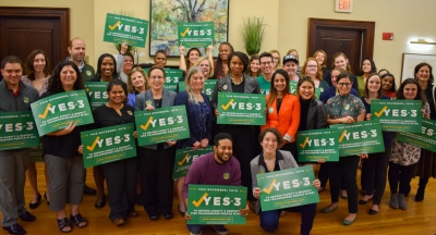 Group of advocates holding Yes on 3 signs