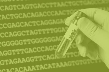 Green-hued image of hand holding vial in front of DNA letters 
